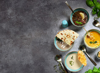 Wall Mural - assorted soups in bowls on the table