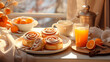 Breakfast with orange juice and croissant. Still life with pastries and coffee. Cinnabons. Baked goods and coffee. Morning coffee cup. Breakfast. Glass of juice. Good morning. Delicious breakfast food