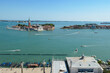 Aerial view from St Mark bell tower Campanile of Venetian Lagoon in Venice, Veneto, Italy, Europe. Looking at island and Church of San Giorgio Maggiore. UNESCO World Heritage. Urban tourism in summer