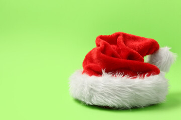 Wall Mural - Santa Claus hat on green background