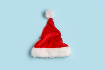 Wall Mural - Santa Claus hat on blue background