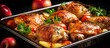 Close-up of oven-baked chicken thighs with apples in a tray.
