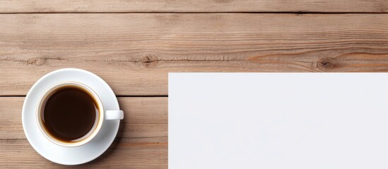 Wall Mural - Coffee next to empty paper on table