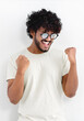 © kucherav - Ecstatic happy man with curly hair in white t-shirt and glasses shouting yeah celebrate winning on white background
