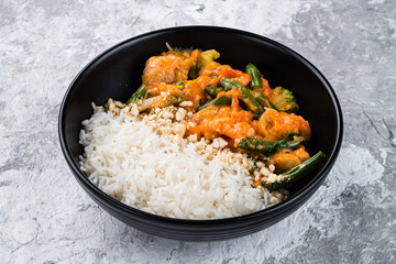 Wall Mural - Boiled rice with stew, broccoli, green beans, tomatoes and onions in a bowl, fresh lunch.