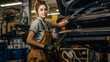 © lastfurianec - A beautiful young car mechanic girl in the workshop at work.