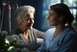 A compassionate nurse shares a warm smile with a woman, as they both admire the delicate beauty of a flower in an indoor setting