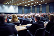 © XaMaps - Business conference with a panel of experts engaging in a conversation, while an audience in formal attire listens intently.