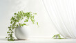 A sleek ceramic base within a harmonious white environment, complimented by the subtle drape of ivy tendrils.