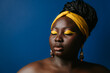 © gstockstudio - Portrait of gorgeous plus size African woman with beautiful make-up and standing on blue background