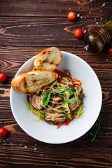 Sticker - Meat salad with beef slices, sweet pepper, lettuce, greens and fried toasts, fresh lunch.