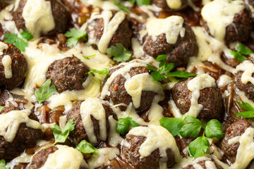 Wall Mural - French onion beef meatballs in iron cast pan.