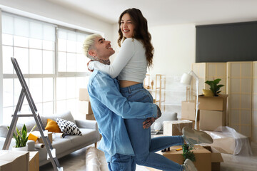 Wall Mural - Happy young couple in room on moving day