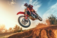 A Off Road Moto Cross Type Motor Bike In Mid Air During A Jump With A Dirt Trail.
