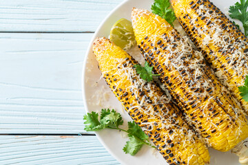 Wall Mural - barbecue and grilled corn with cheese and lime