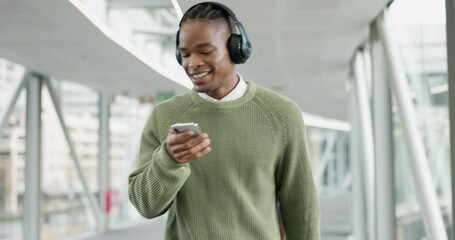 Canvas Print - Music, happy and business with black man and phone for streaming, social media and radio. Podcast, technology and headphones with male employee dancing in office building for audio and mobile app