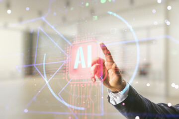 Wall Mural - Double exposure of businessman hand working with creative artificial Intelligence abbreviation hologram on blurred office background. Future technology and AI concept