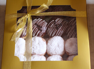 Wall Mural - sweet chocolate and white donut cake in a cake box