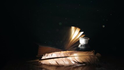 Wall Mural - Book, pen and inkwell in a ray of light