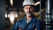 © CStock - Smiling worker in yellow hardhat at construction site