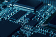 Modern electronic circuit board with processor, integrated circuits and surface mounted passive components close up. Technology background