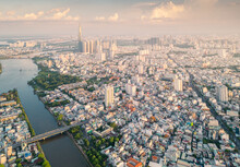 Panoramic View Of Saigon, Vietnam From Above At Ho Chi Minh City's Central Business District. Cityscape And Many Buildings, Local Houses, Bridges, Rivers