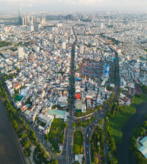 Wall Mural - Panoramic view of Saigon, Vietnam from above at Ho Chi Minh City's central business district. Cityscape and many buildings, local houses, bridges, rivers