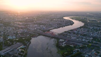 Wall Mural - Panoramic view of Saigon, Vietnam from above at Ho Chi Minh City's central business district. Cityscape and many buildings, local houses, bridges, rivers