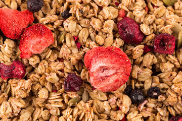 Wall Mural - Muesli oat cereals close up background with dry fruits