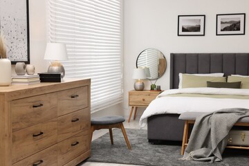 Sticker - Window with horizontal blinds and comfortable bed in room