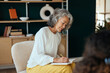 © Westend61 - Psychotherapist writing details of counseling therapy in diary