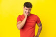 © luismolinero - Young caucasian handsome man isolated on yellow background with toothache