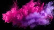 Pink and purple powder explosion on a black background. Splashes of Holi paint powder in feminine colors of violet and pink
