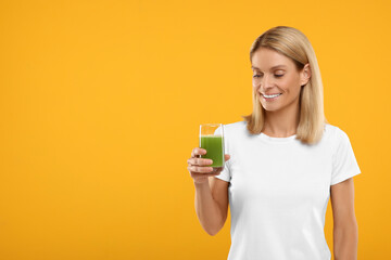 Sticker - Happy woman with glass of fresh celery juice on orange background. Space for text