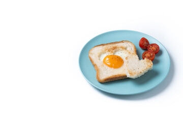 Wall Mural - Valentine's Day breakfast with egg with tomatoes, heart shaped and toast bread isolated on white background. Copy space