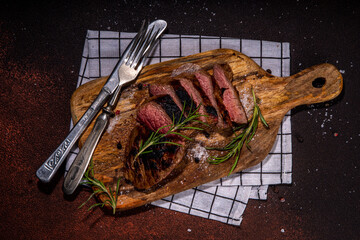 Sticker - Grilled meat steak on dark table