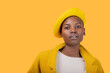 © ADDICTIVE STOCK - Young woman wearing yellow flat cap and coat