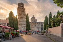 View Of Souvenir Stalls And Leaning Tower Of Pisa At Sunset, UNESCO World Heritage Site, Pisa, Province Of Pisa, Tuscany