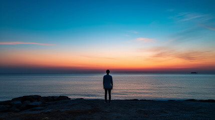 Wall Mural - Silhouetted faceless portrait at sunset, outline of a figure against a vivid sky, tranquil sea horizon