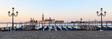 Gondolas Moored On The Lagoon, San Giorgio Maggiore Beyond, Riva Degli Schiavoni, Venice, UNESCO World Heritage Site, Veneto, Italy