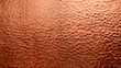 Hammered copper plate texture with a lustrous, dimpled surface.
