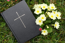 Bible On The Grass With Primrose At Springtime, France