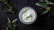 Organic Skincare Cream with Natural Olive Branches on Dark Background