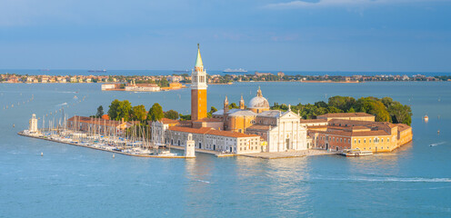 Aerial view of Saint George Island, Italian: Isola San Giorgio, with Campanile San Giorgio in Venetian Lagoon, Venice, Veneto Region, Italy. Photography on sunny summer day