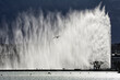 Geneva, Switzerland, Europe - Jet d'Eau fountain (powered by jet engine) on Lake Geneva, city's most famous landmark, strong wind