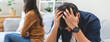 Family problem concept, Close-up hands of Asian wife sitting on sofa and husband sitting back to back in the living room at home have problems in a relationship and have an argument