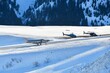 Private jet is landing on Courchevel airport by winter