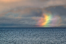 Firebow On The Moray Firth. The Stack Of Colors Is Known As A Circumhorizon (or Circumhorizontal) Arc—or, Sometimes, A “firebow.”
