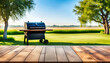 Table with summer background and barbecue grill and copy space