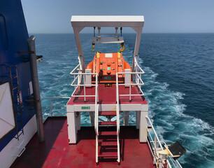 Muster stations and free fall life boat of a merchant ship at sea